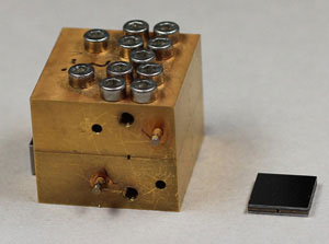 Picture: On the left, an amplifier using traditional waveguide technology. On the right, a component based on VTT's micromechanical waveguides.
